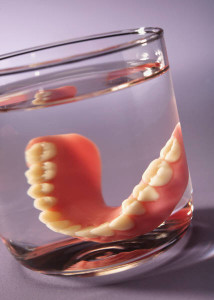 Ask your dentist for help choosing between dental implants and dentures. Think about comfort, appearance, practicality, and cost.