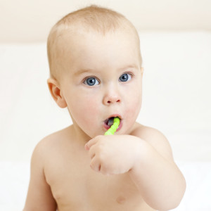 New ADA recommendations suggest brushing your infant's baby teeth with a smear of fluoride toothpaste.